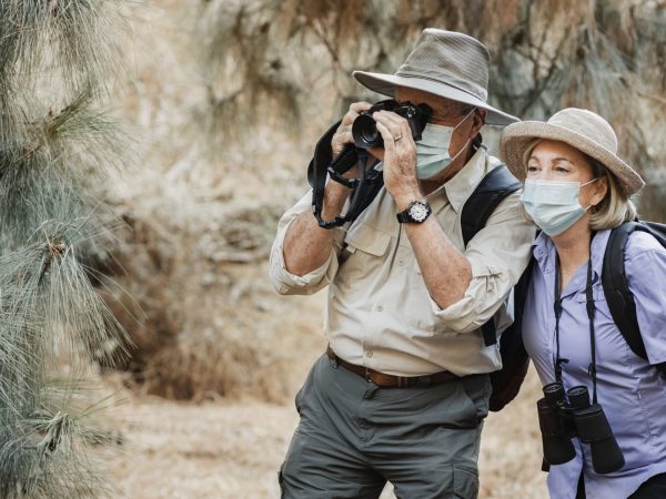 Active senior couple enjoying the beauty of nature during Covid-19 pandemic