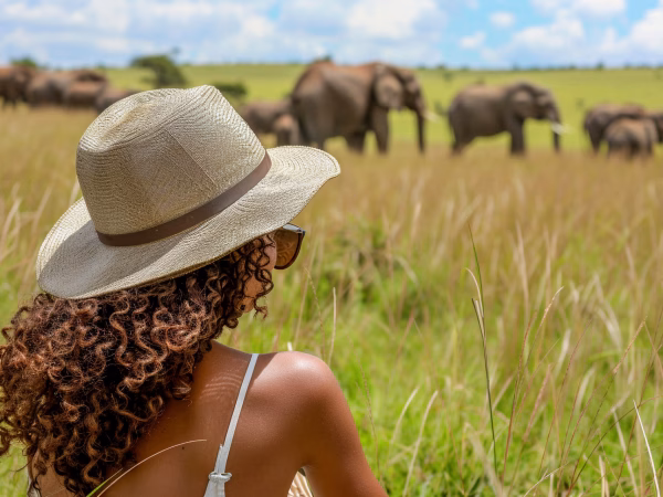 Advertising photo of a Safari tourist woman person. Casual. Featured social image. --chaos 10 --ar 3:2 --style raw Job ID: 4fa1bc5d-714a-4bd0-a24b-c6b13f98f530