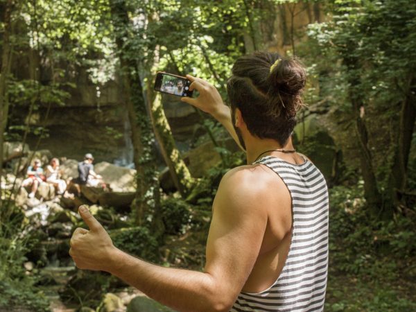 Selfie moment: boy taking a selfie during a trip